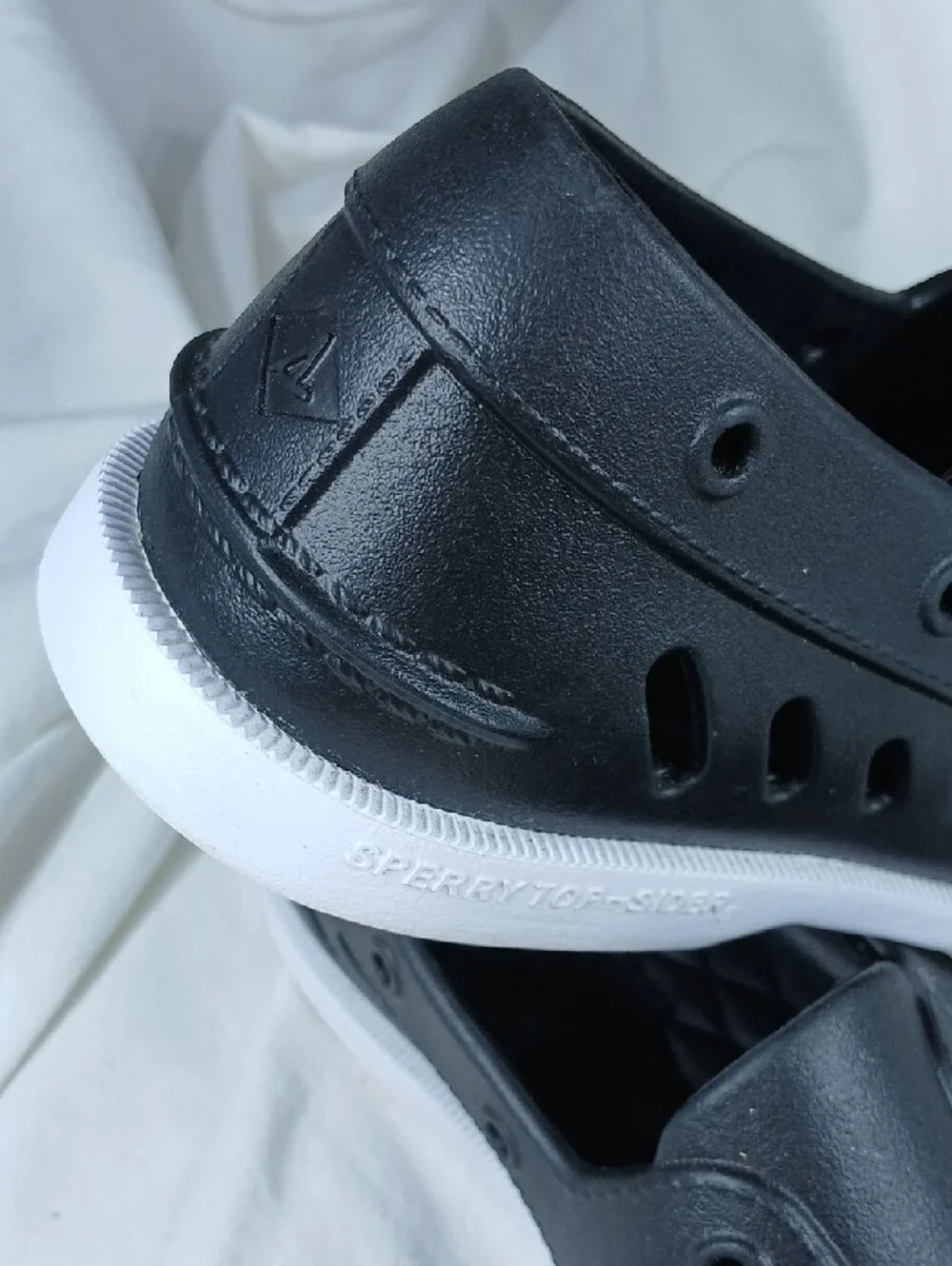 Sperry Black Perforated Slip-On Boat Shoes with White Sole